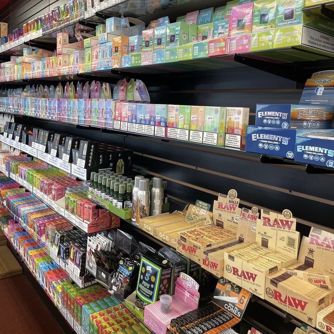 Colorful disposable vape products lined on shelves